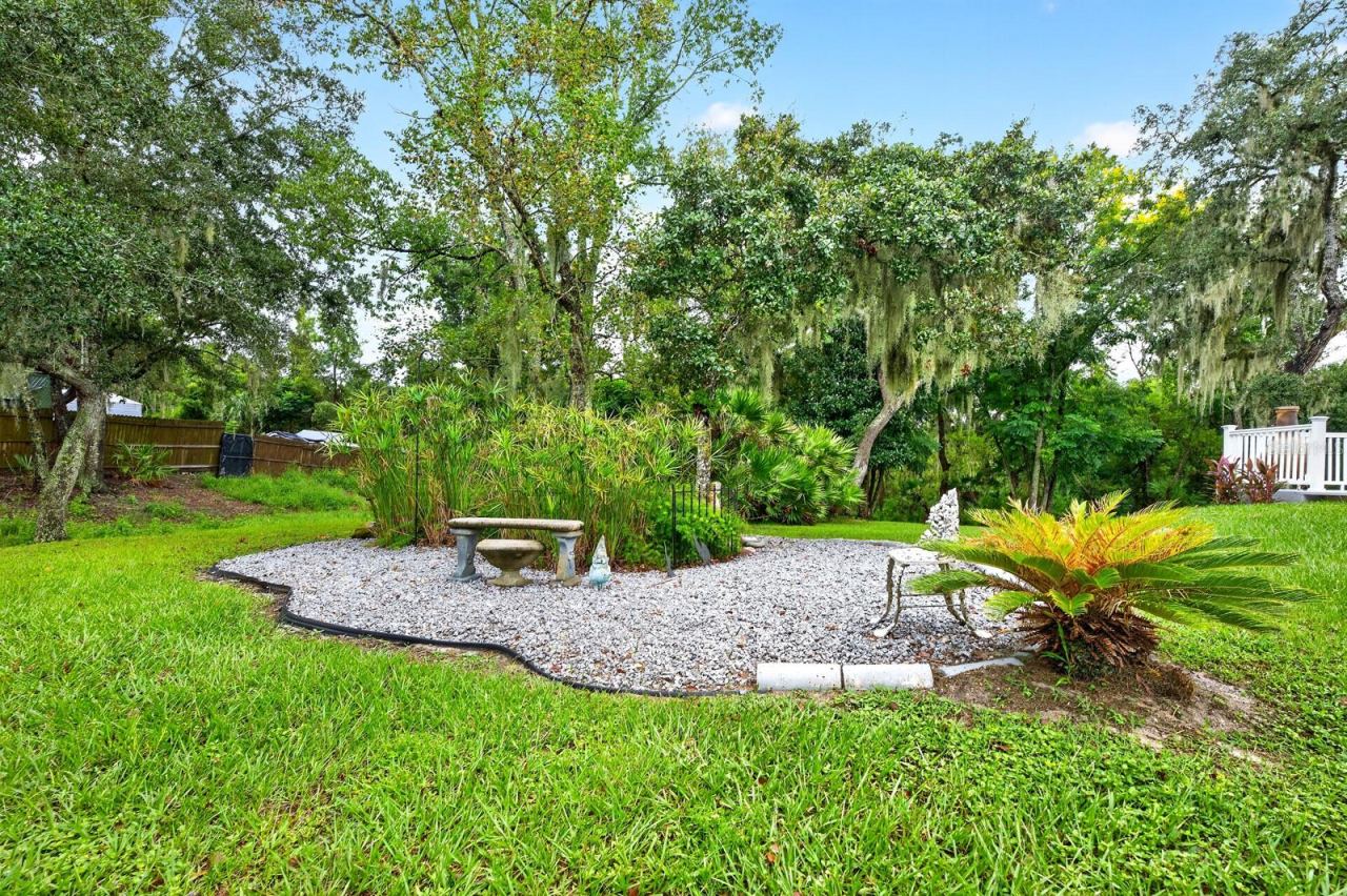 Photo 3 of 20: A small GARDEN AREA along the side yard has its own ELECTRICAL OUTLET, adding convenience for gardening projects or other outdoor uses.
