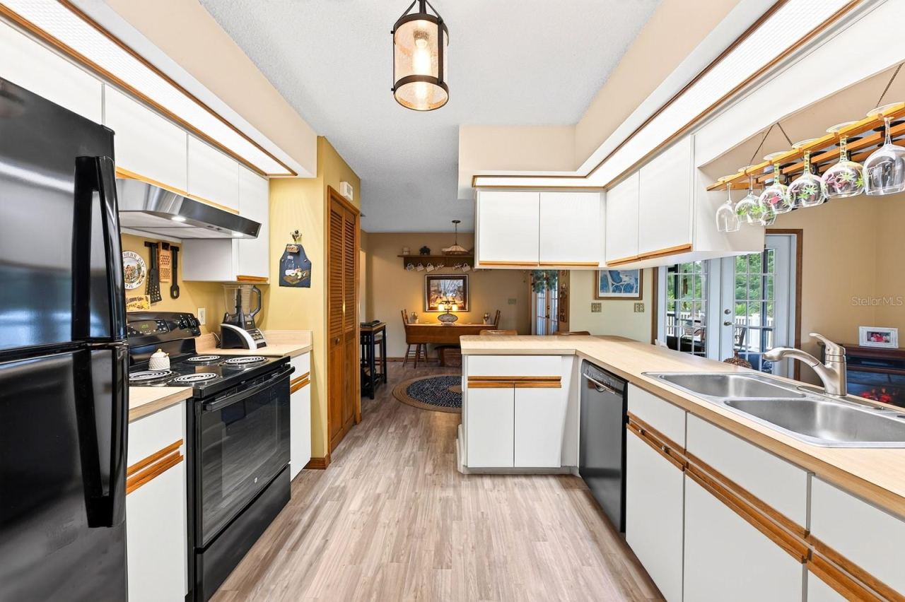 Photo 11 of 20: The large Kitchen offers an ABUNDANCE OF CABINETRY and counter space.