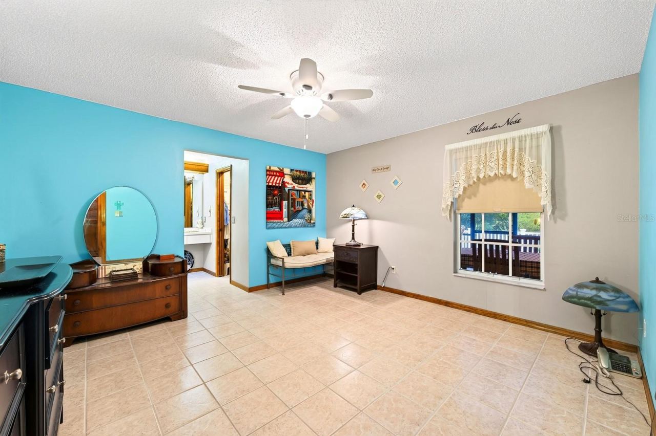 Photo 17 of 20: The SPLIT-BEDROOM FLOOR PLAN provides added privacy with the Primary Bedroom featuring a GENEROUS WALK-IN CLOSET and an en suite Bath.