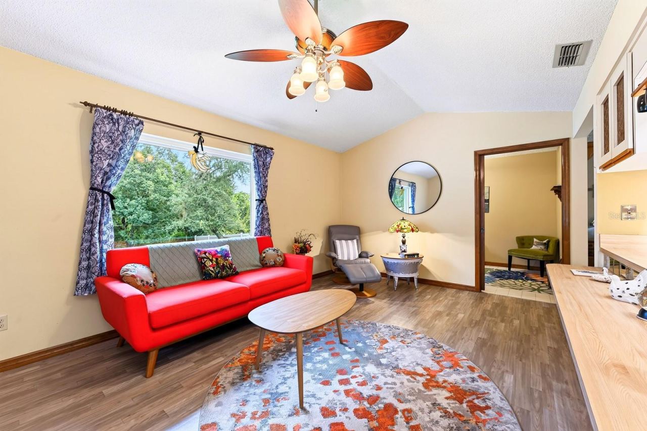 Photo 9 of 20: A large NEW PICTURE WINDOW brings in natural light and enhances the Family Room's welcoming atmosphere.