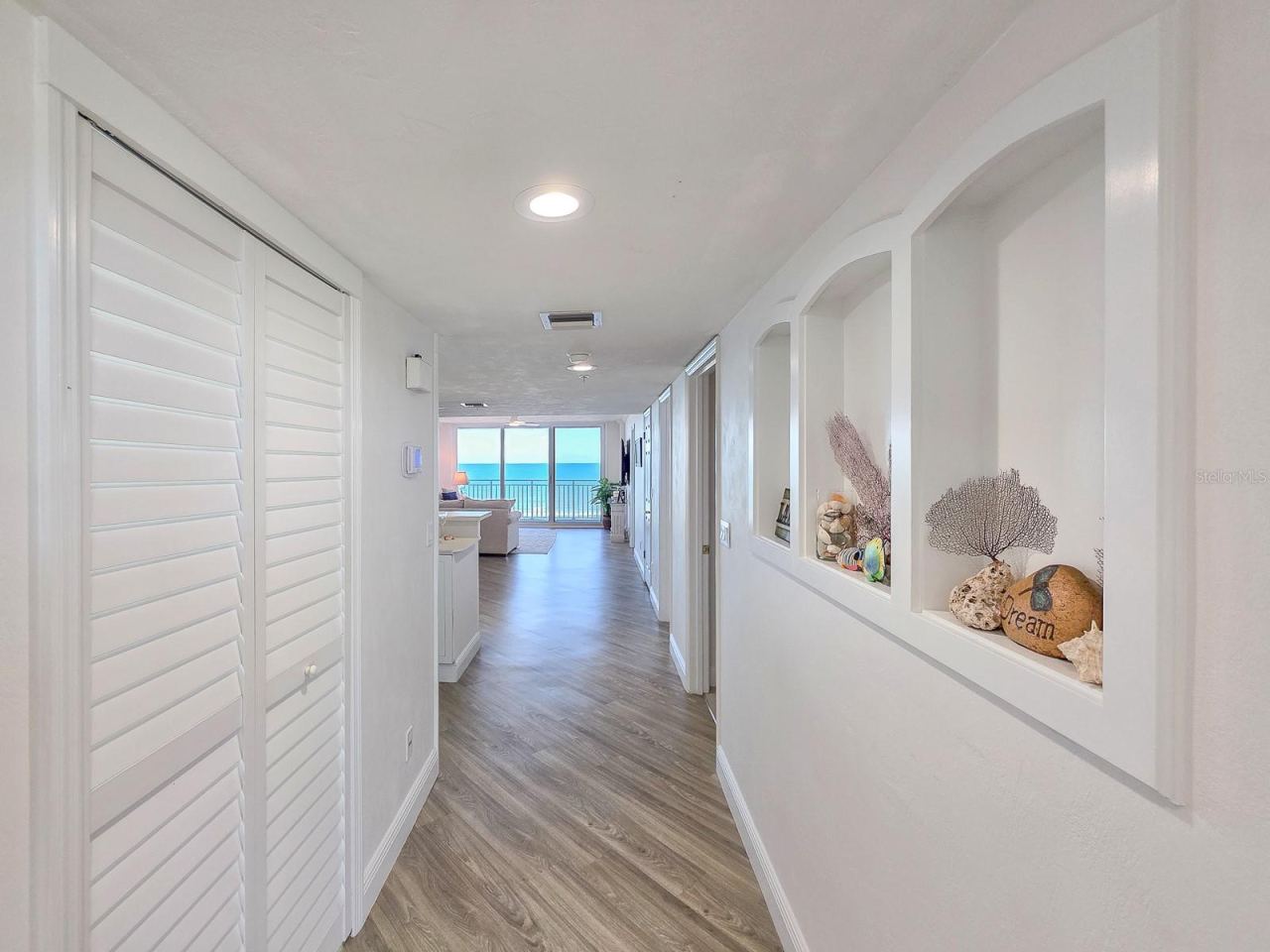 Photo 10 of 20: Hallway with laundry on left and built-ins on left.