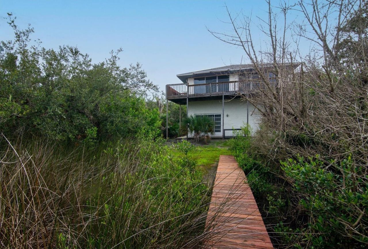 Photo 15 of 20: View from dock walkway back to house. Mangroves present on either side