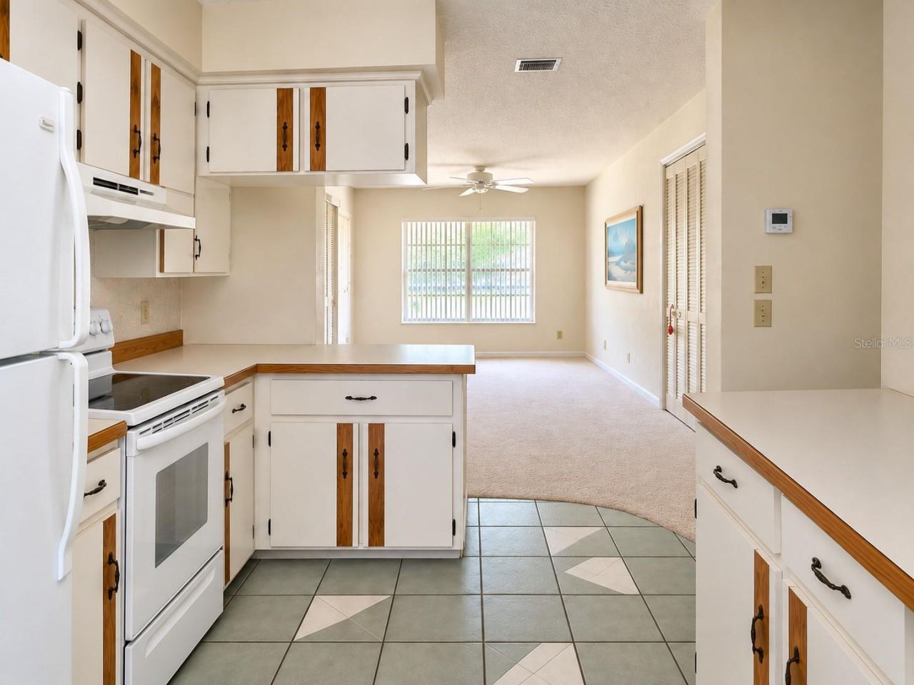 Photo 9 of 20: Kitchen opens to family room/den and dining room