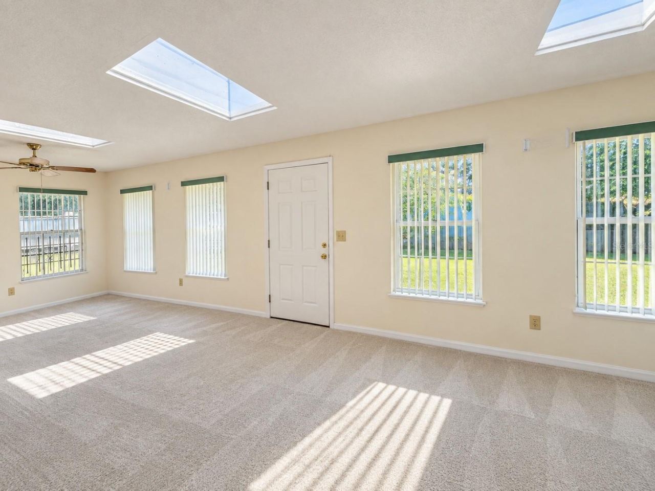 Photo 13 of 20: Family room across back. Accessed from Dining and Primary