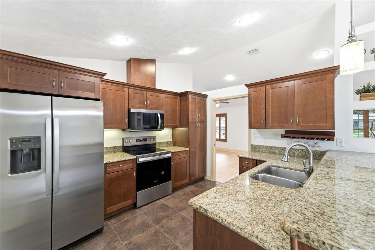 Photo 7 of 20: The heart of the home features generous workspace and seamless flow into the living areas.