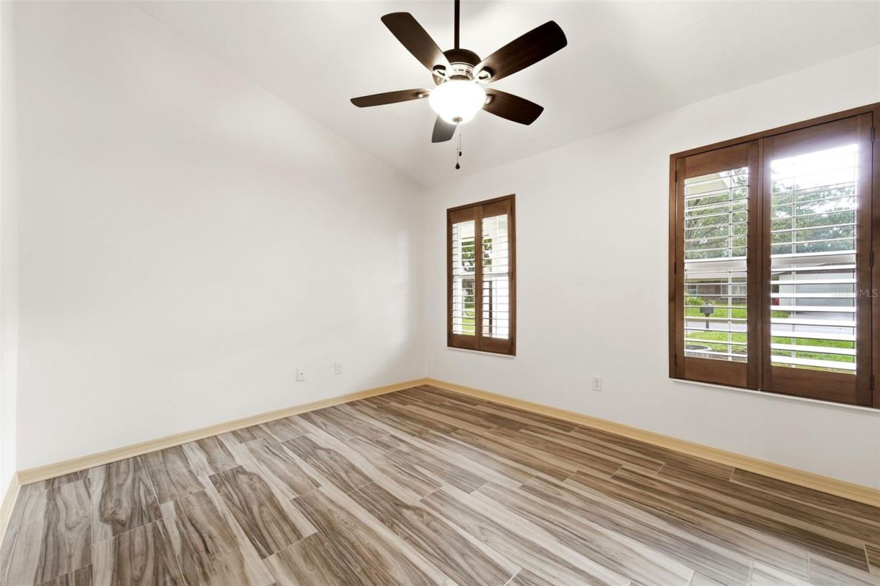 Photo 12 of 20: Plantation shutters and vaulted ceilings add warmth and character throughout.