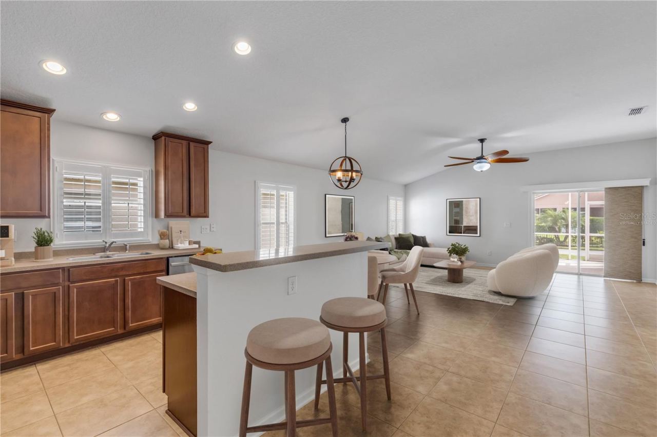 Photo 4 of 20: Virtually Staged kitchen with great flow to Family Room.