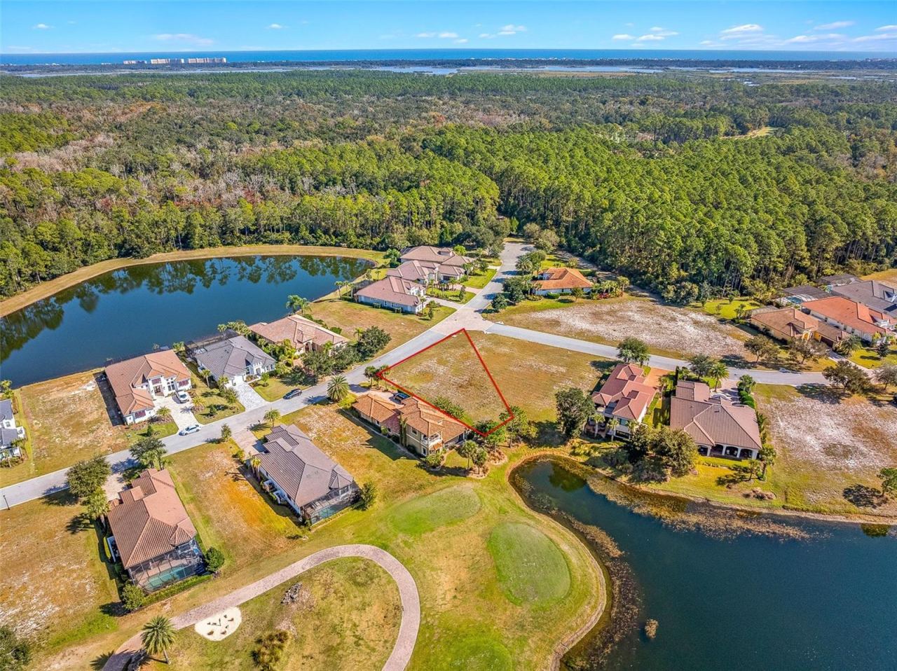 Photo 12 of 19: Aerial view from lake towards lot