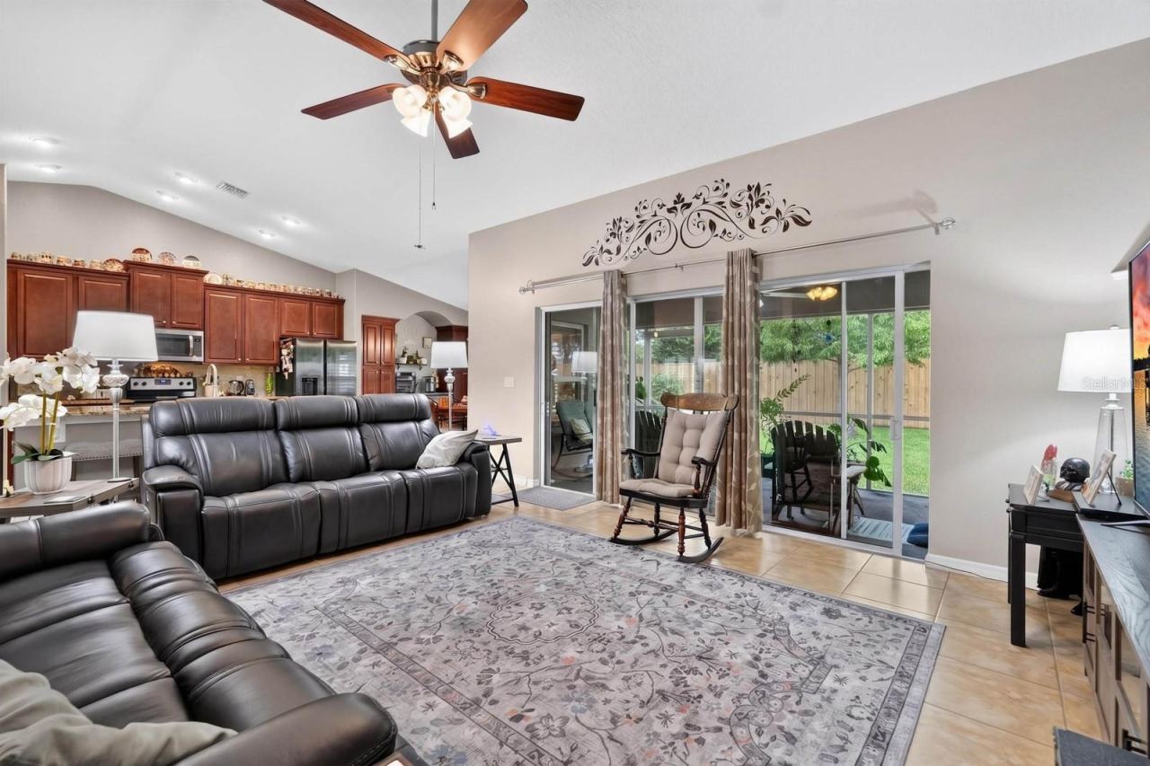 Photo 10 of 20: large sliding door opens up to covered screened lanai