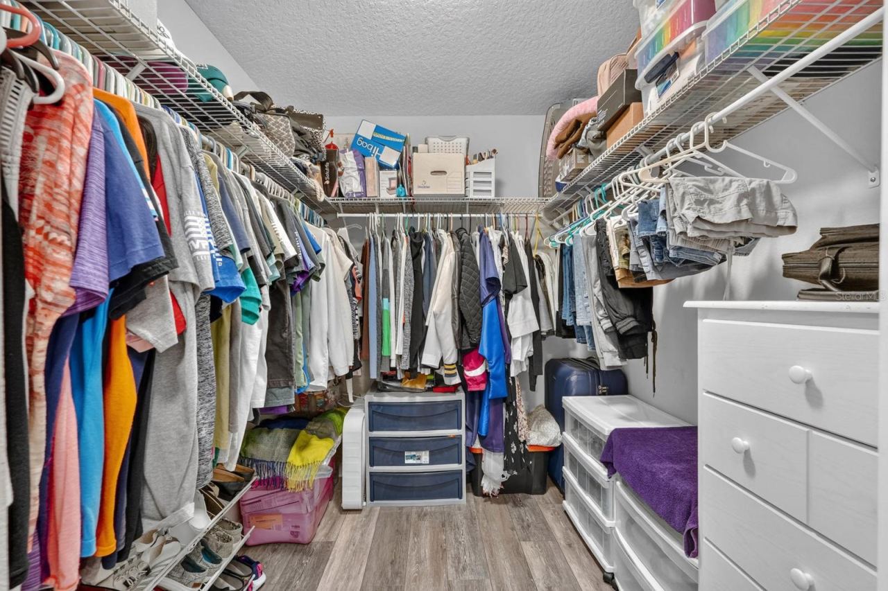Photo 17 of 20: One of 2 large walk in closets in the primary bedroom