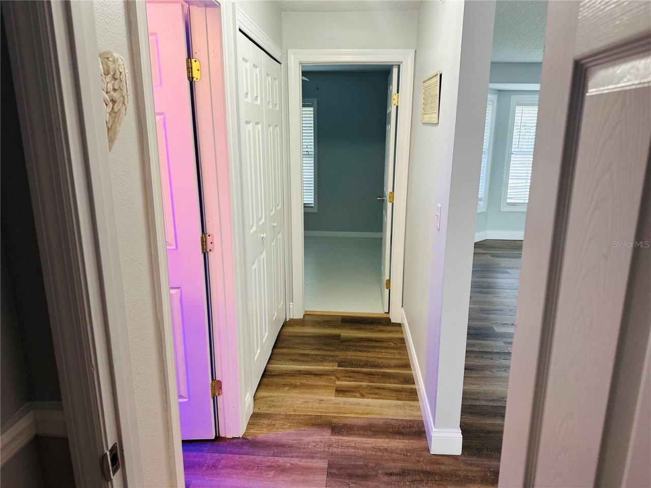 Photo 10 of 20: Hallway to guest bathroom and 3rd bedroom
