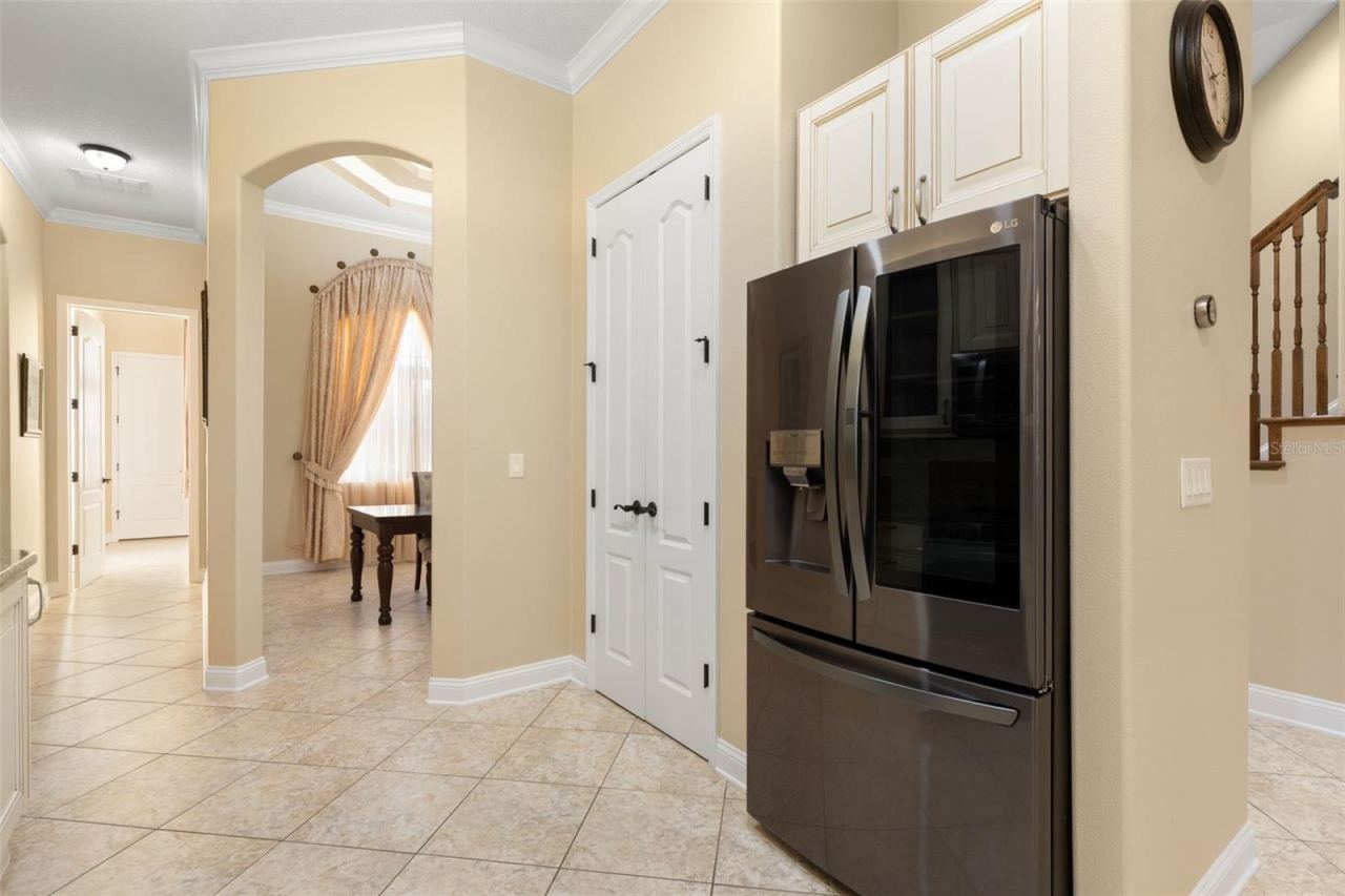 Photo 8 of 20: Thoughtfully designed for everyday convenience, the kitchen connects easily to the adjoining dining area.