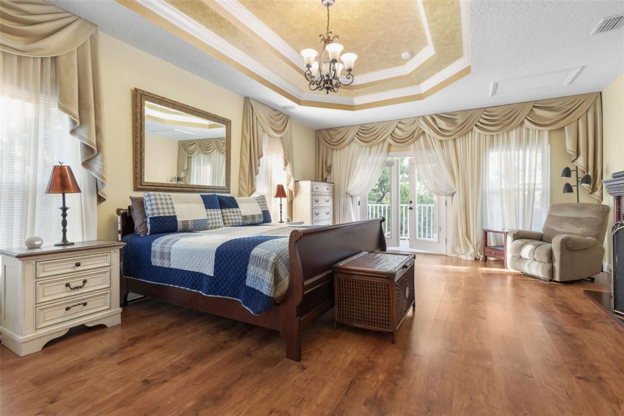 Photo 17 of 20: A versatile upstairs retreat currently used as a primary bedroom, offering a private space to relax and unwind.