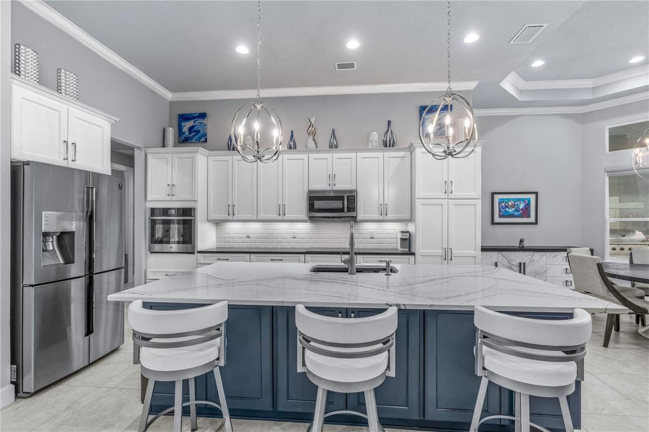 Photo 18 of 20: Gourmet Kitchen Island & Breakfast Bar
