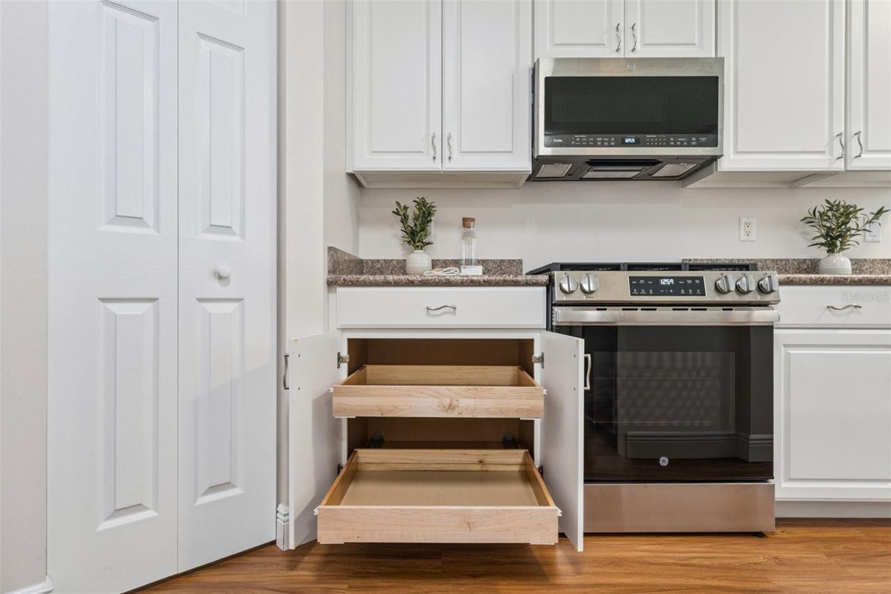 Photo 8 of 20: Kitchen cabinets has Pull-out shelving & 2 closet pantry's