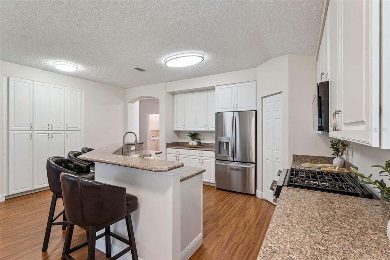 Photo 9 of 20: Kitchen w/ a breakfast bar, 42" "soft close" cabinets & stainless steel appliances