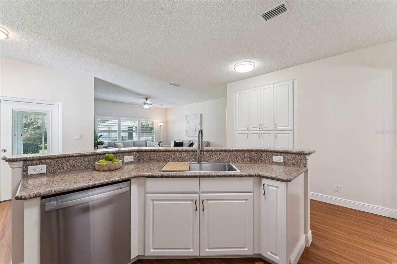 Photo 12 of 20: View of the Family Room & Dinette area from the Kitchen