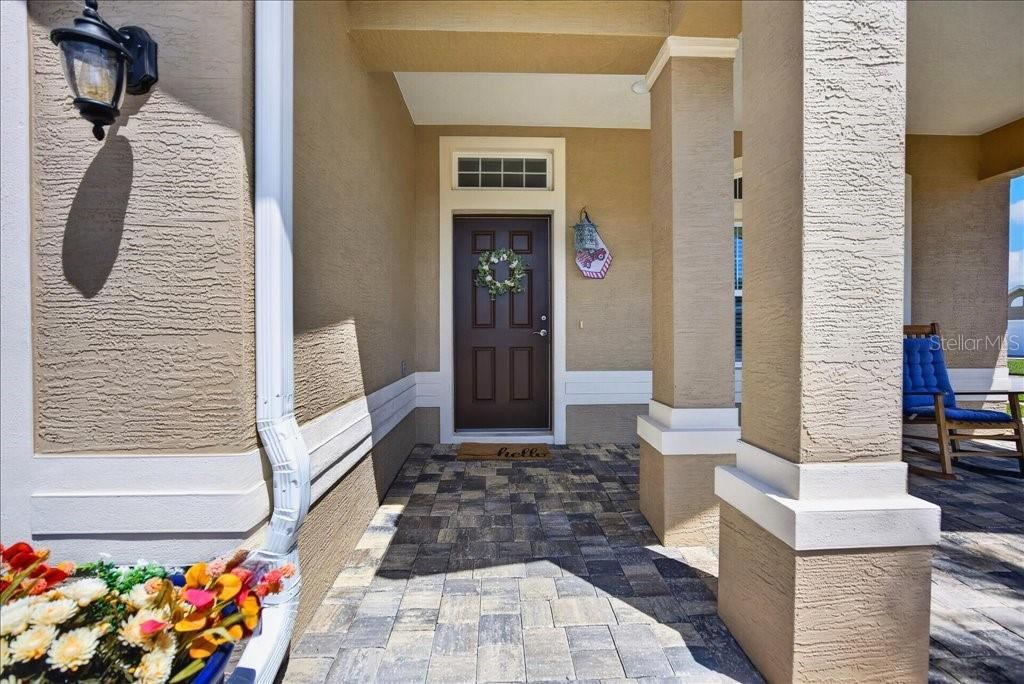 Photo 6 of 20: Paved driveway and expansive front porch