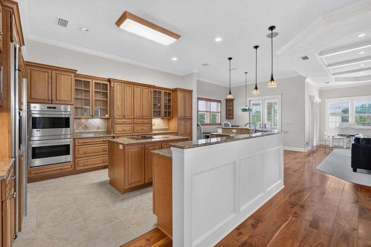 Photo 17 of 20: Made for the chef and everyone who gathers around them... an expansive kitchen with incredible storage, generous prep space, double ovens and room to entertain.