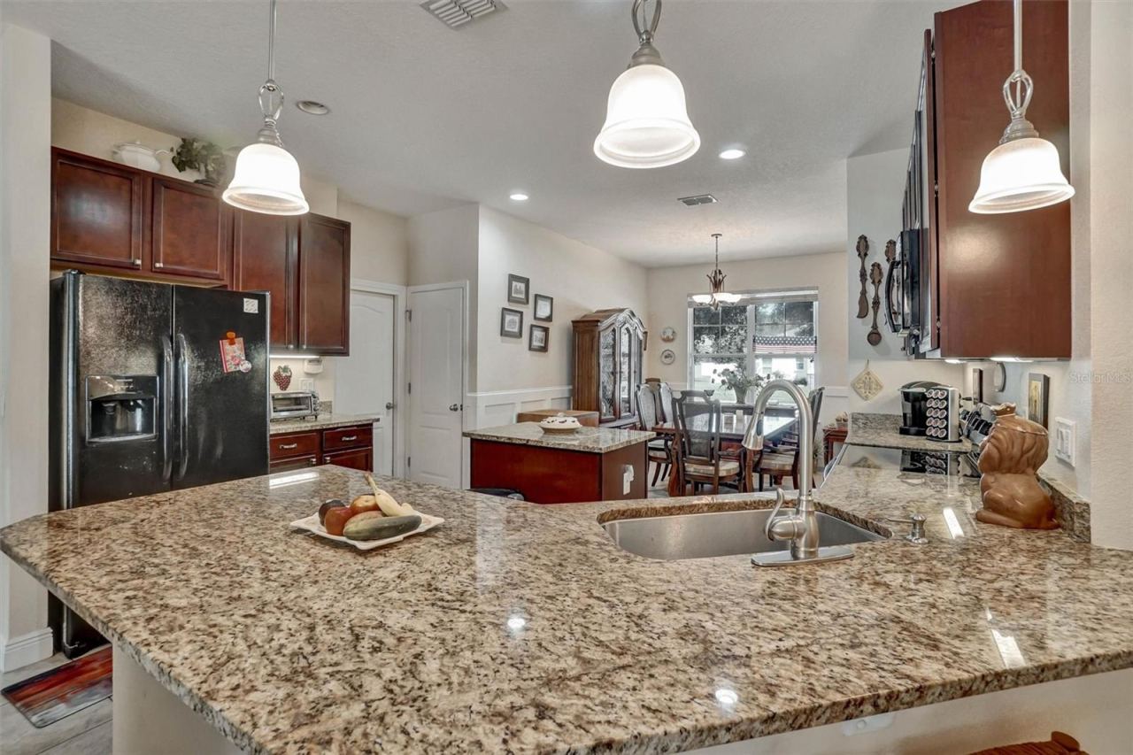 Photo 9 of 20: Kitchen CountertopLarge granite countertop provides generous workspace and overlooks the dining area.