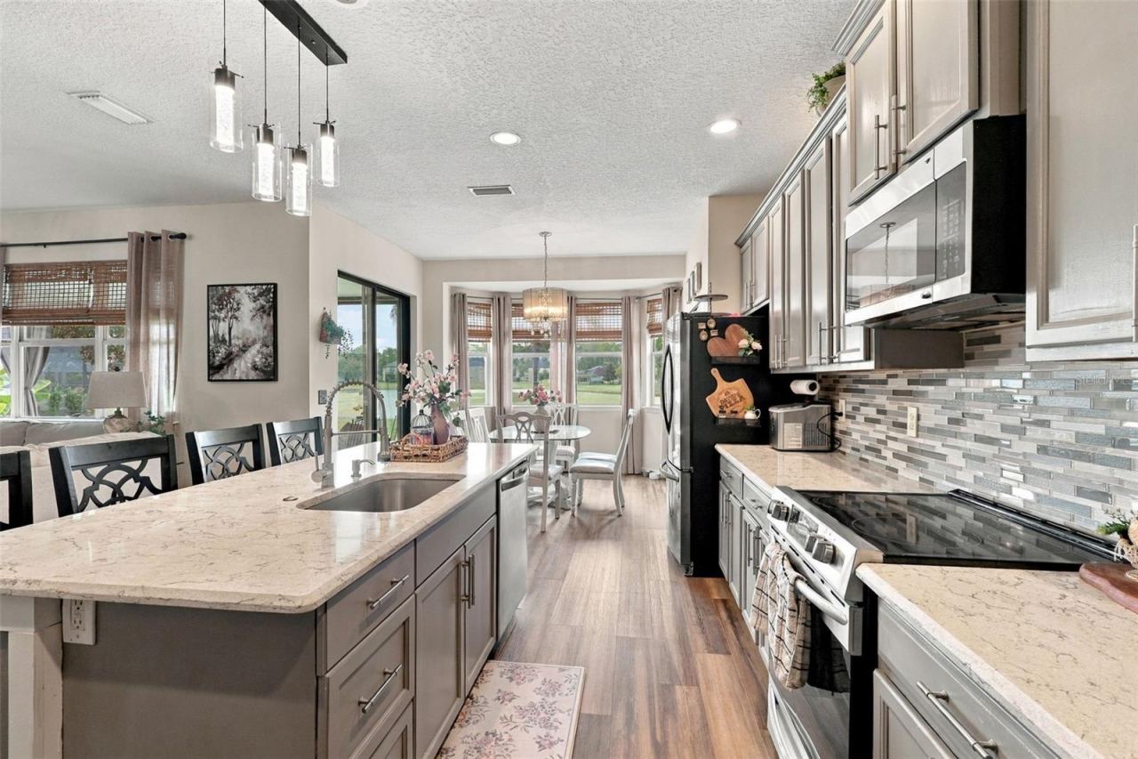 Photo 8 of 20: Stainless steel appliances convey and look at how much storage these 42" upper cabinetry offers!!