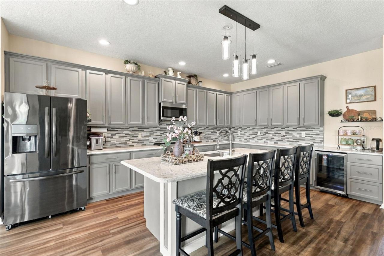 Photo 3 of 20: Look at this gorgeous updated kitchen with custom tile backsplash and quartz countertops.