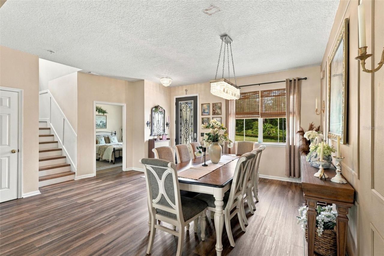 Photo 13 of 20: Formal dining area towards bonus room, currently being utilized as a 6th bedroom.