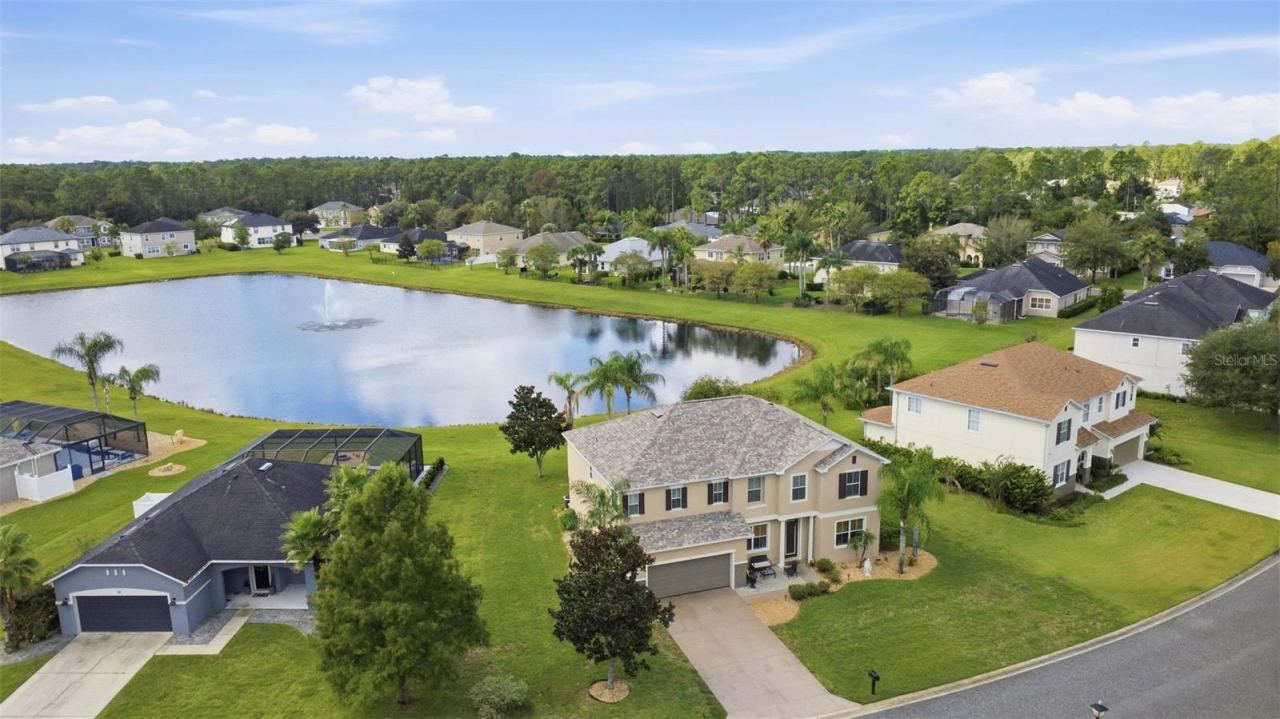 Photo 2 of 20: Aerial view of property. NO rear neighbors enjoy the view of the pond.