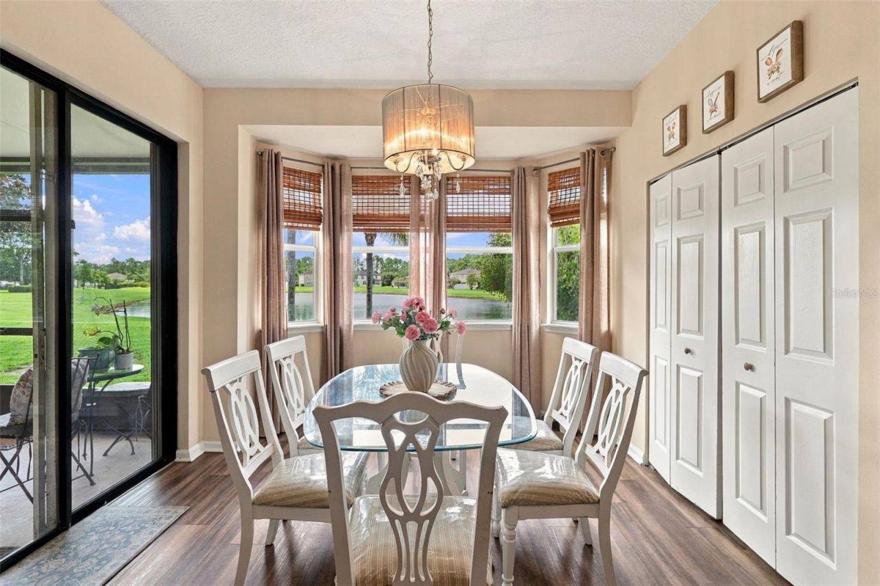 Photo 9 of 20: Enjoy the views of the pond from this dining area. Huge pantry at right.