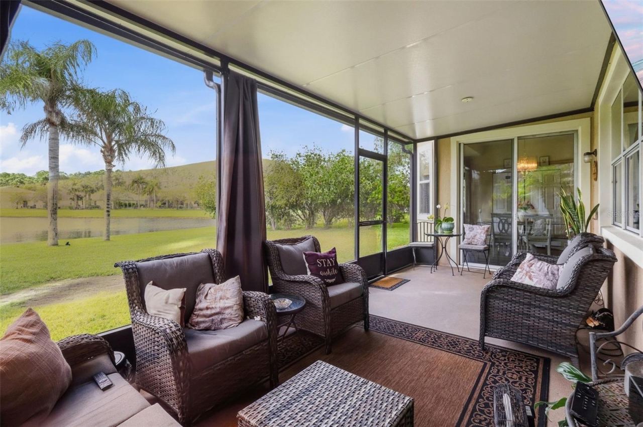 Photo 6 of 20: Inside the screened porch you will be able to enjoy the lakefront view without the bugs!