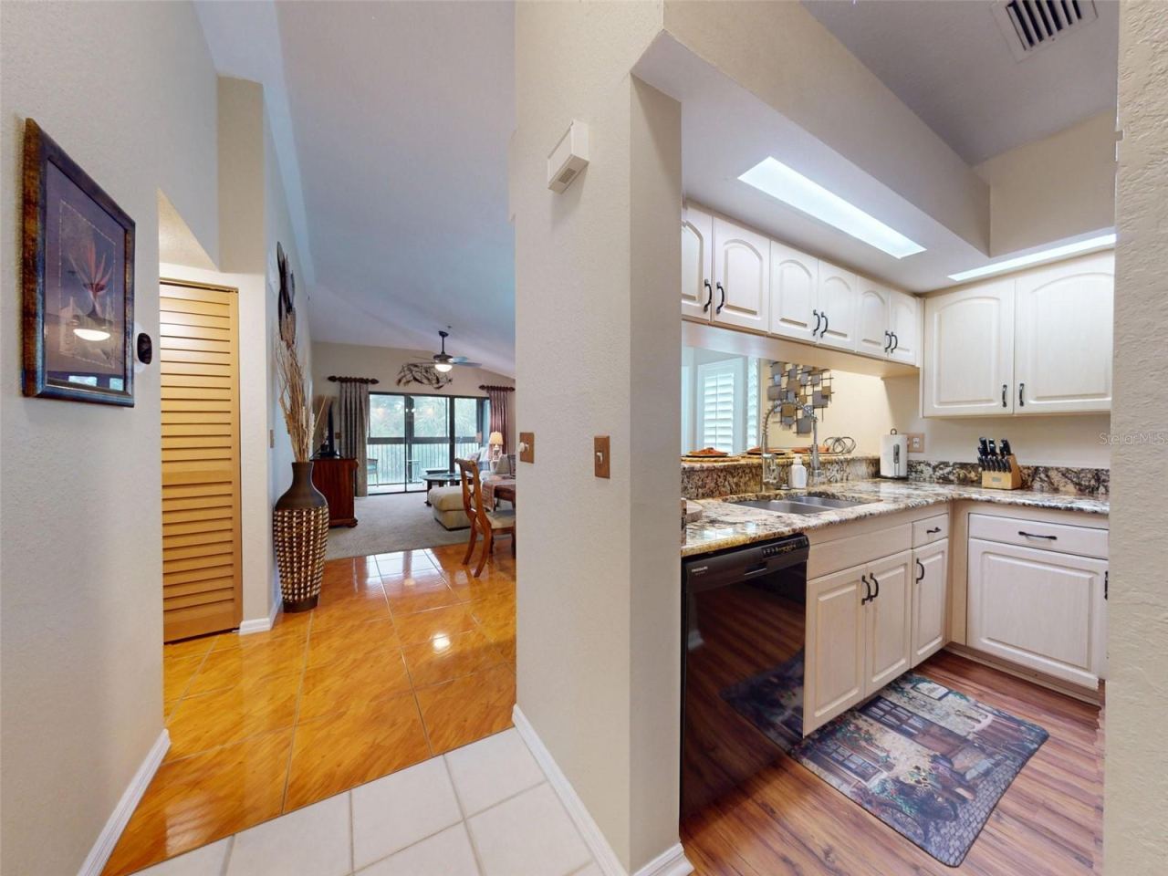 Photo 6 of 20: Kitchen leading to Dining/Living
