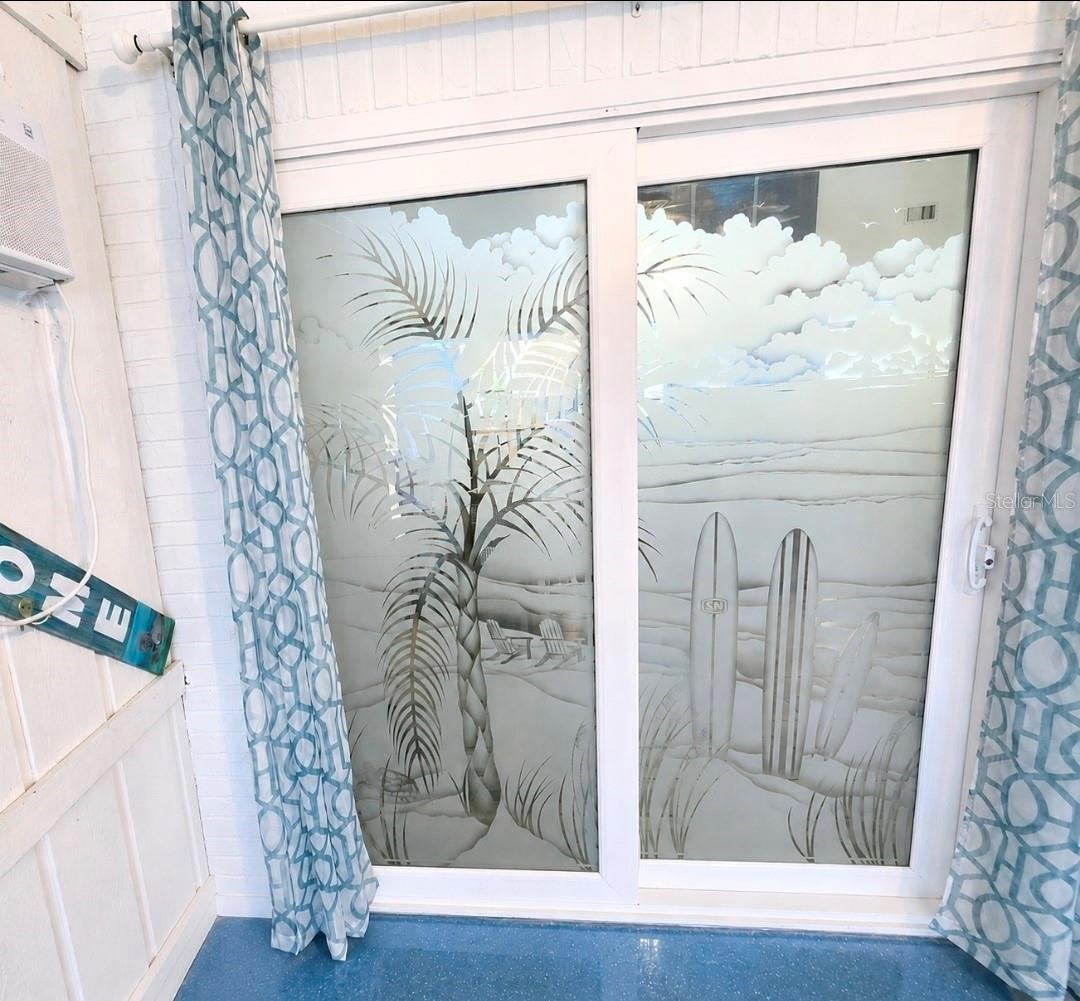 Photo 15 of 20: Etched sliders with tropical themed doors. total