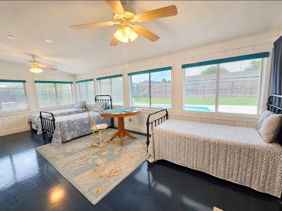 Photo 17 of 20: Flex room currently a 4th bedroom. Ocean epoxy flooring. Access to pool and backyard.