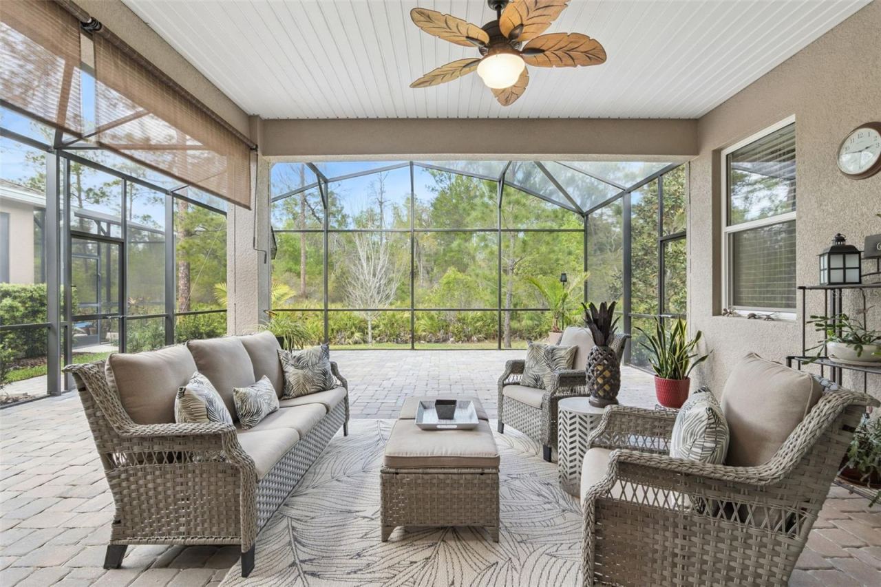 Photo 12 of 20: From the lanai, enjoy nature and the peacefulness of the beautiful wooded area behind the home