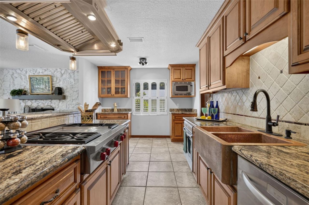 Photo 12 of 20: Wolf GAS Range with griddle center. Farmhouse style copper double sink