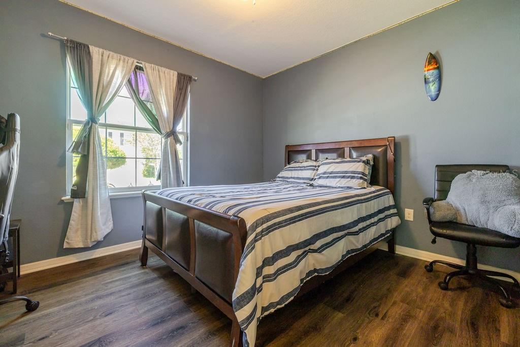 Photo 6 of 20: Bedroom 1 with vinyl plank floors