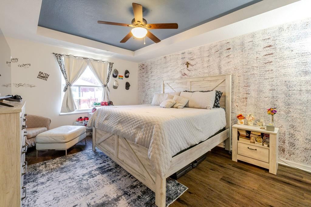 Photo 16 of 20: Primary bedroom with tray ceiling