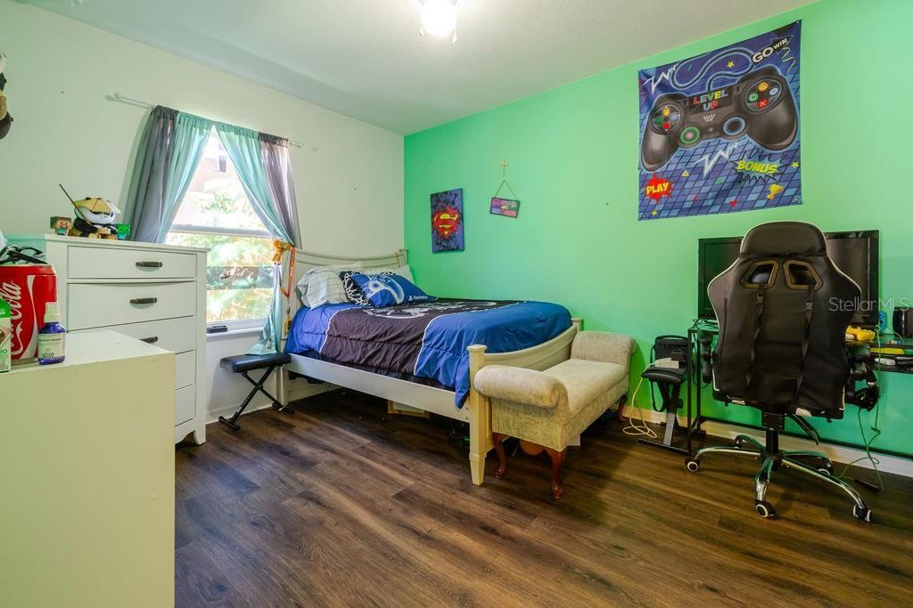 Photo 9 of 20: Bedroom 2 with vinyl plank floors