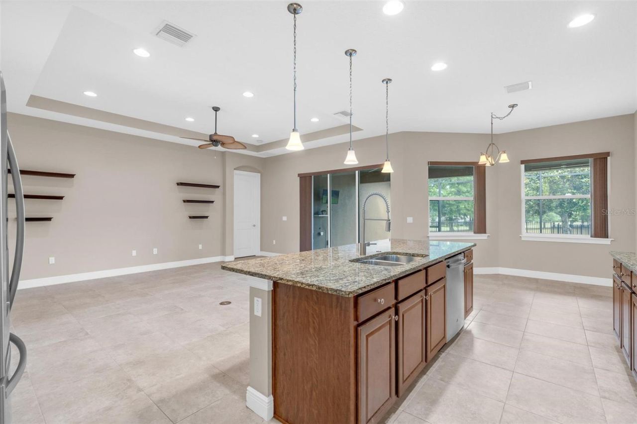 Photo 12 of 20: BUTLERS PANTRY WITH VIEWS OF LIVING / KITCHEN TO BACKYARD