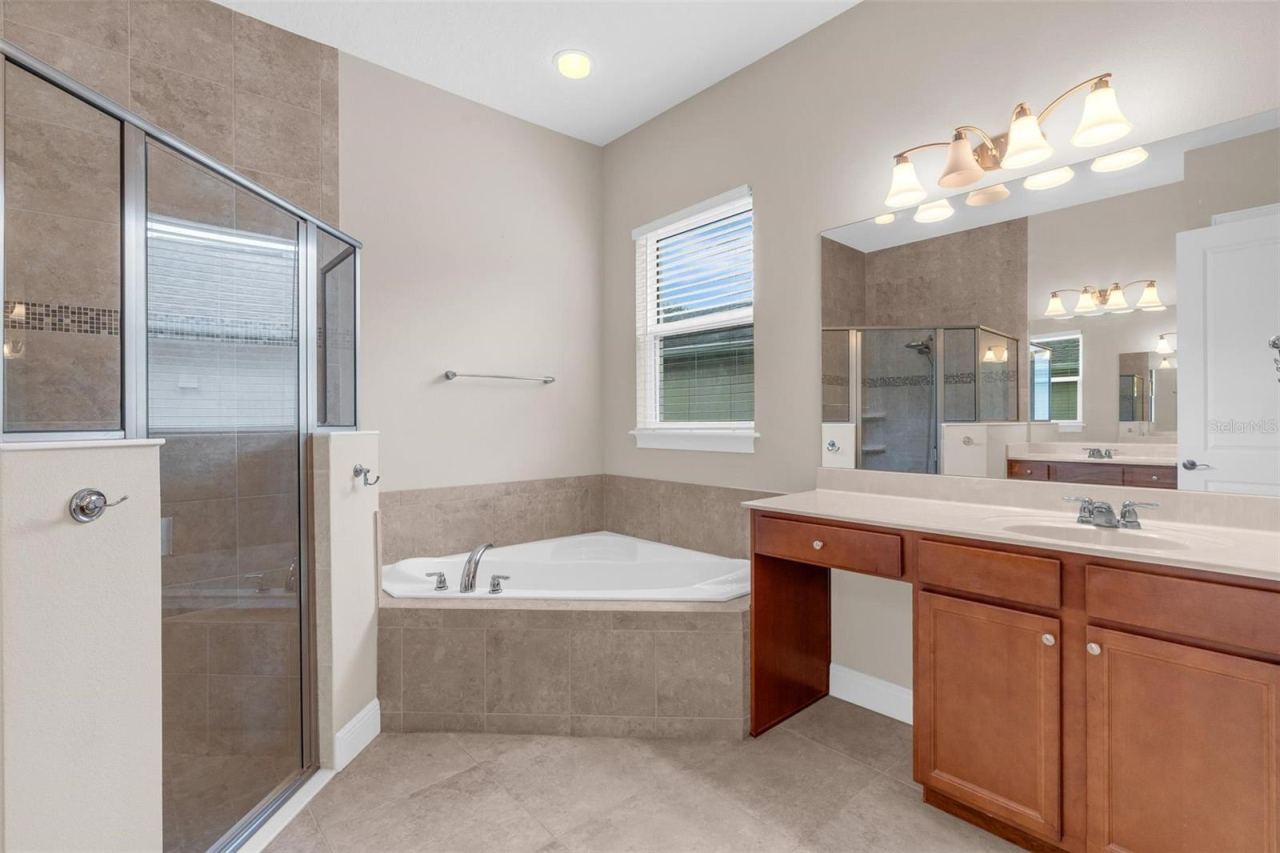 Photo 17 of 20: PRIMARY BATHROOM. DUAL SINKS, SOAKING TUB + WALK IN SHOWER