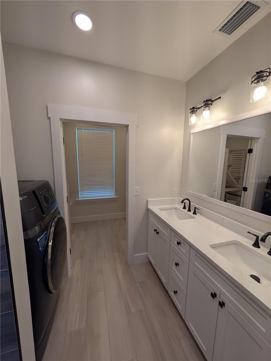 Photo 20 of 20: Main House...2nd floor primary bathroom with washing machine/dryer