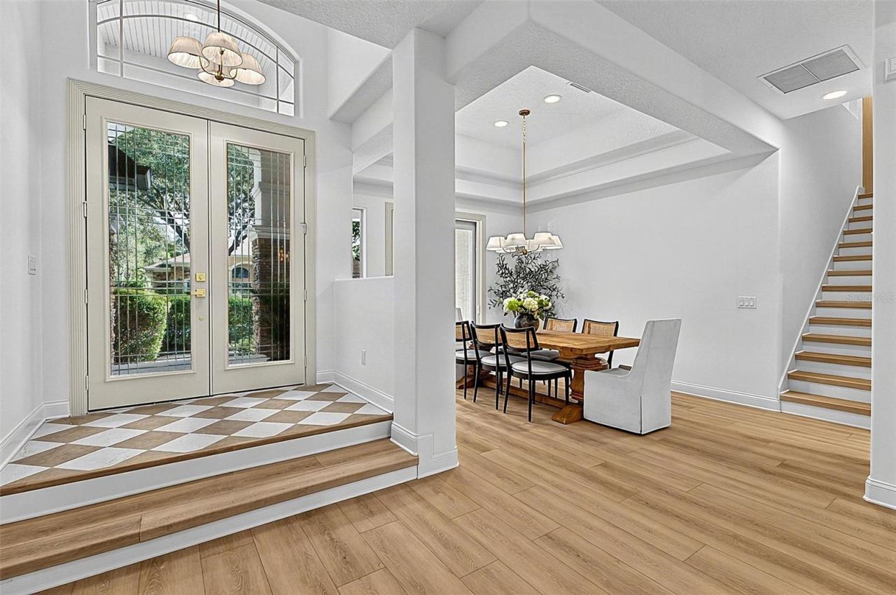 Photo 18 of 20: Front Elegant Foyer/ Formal Dining Room / staircase to 4th Bedroom/ flex room
