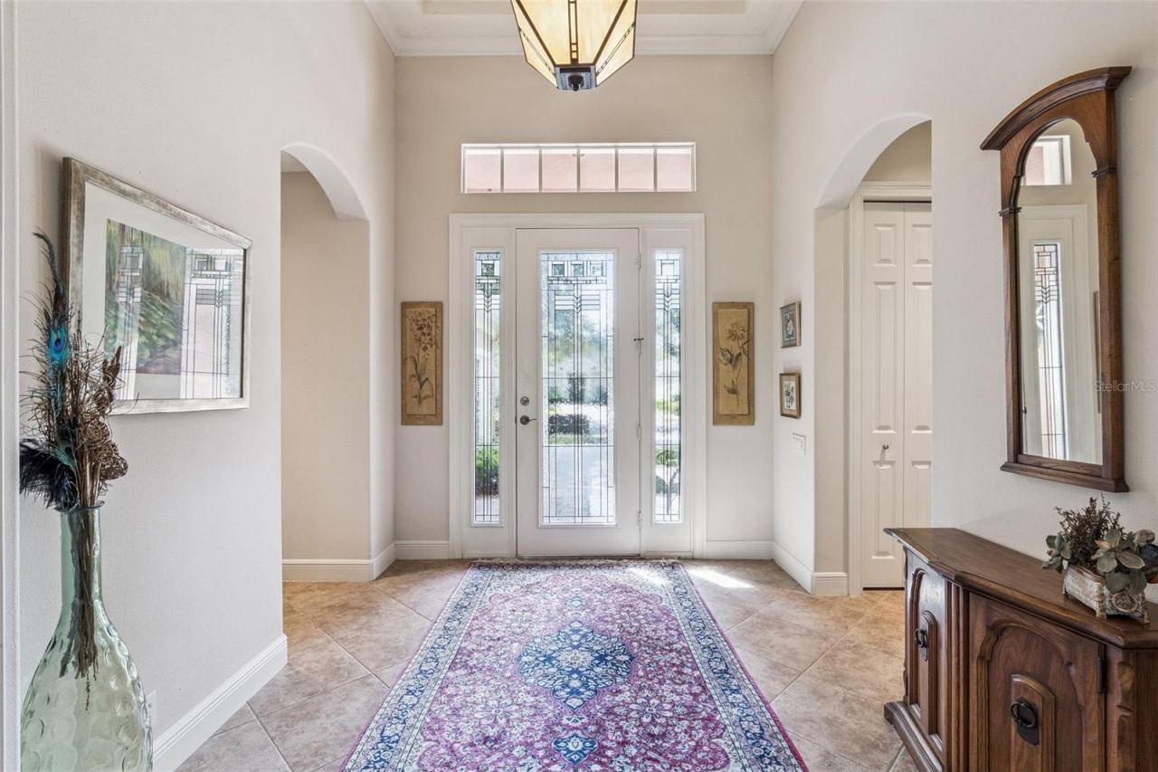 Photo 2 of 20: 9' x 10' Foyer entryway w/ leaded glass front door, tray ceiling & crown molding