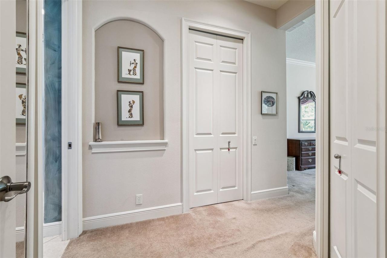 Photo 19 of 20: Entry into Primary Bedroom w/ 2 walk-in closets