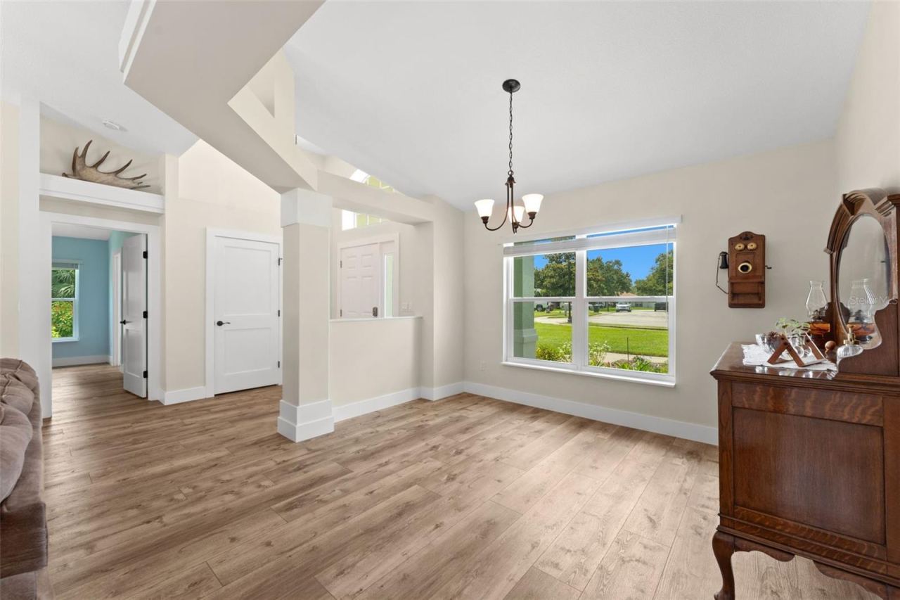 Photo 10 of 20: Views of dining room, foyer and entry to primary wing.
