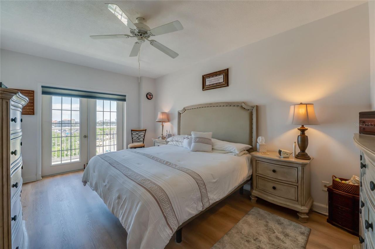 Photo 13 of 20: Primary bedroom with access to private balcony
