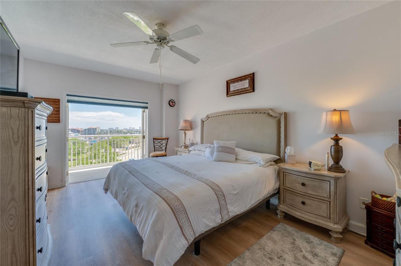 Photo 12 of 20: Primary bedroom with private balcony doors open