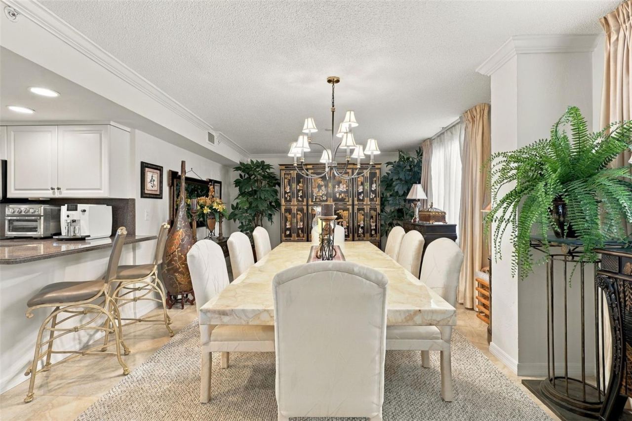 Photo 6 of 20: Dining Room features elegant tile and dining table seating 8