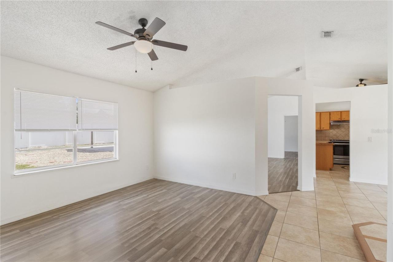 Photo 13 of 20: Living Room and Foyer