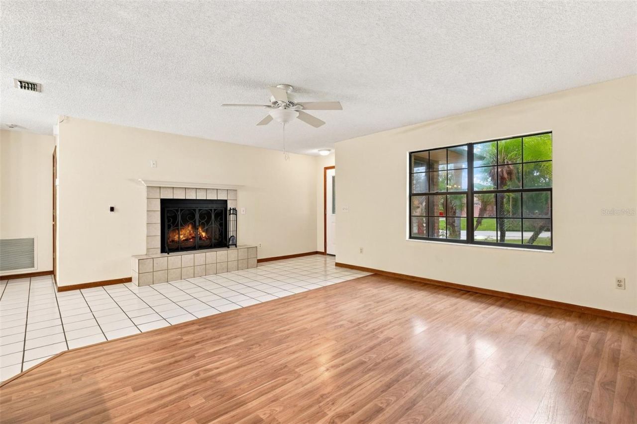 Photo 13 of 20: Living room with wood burning fireplace